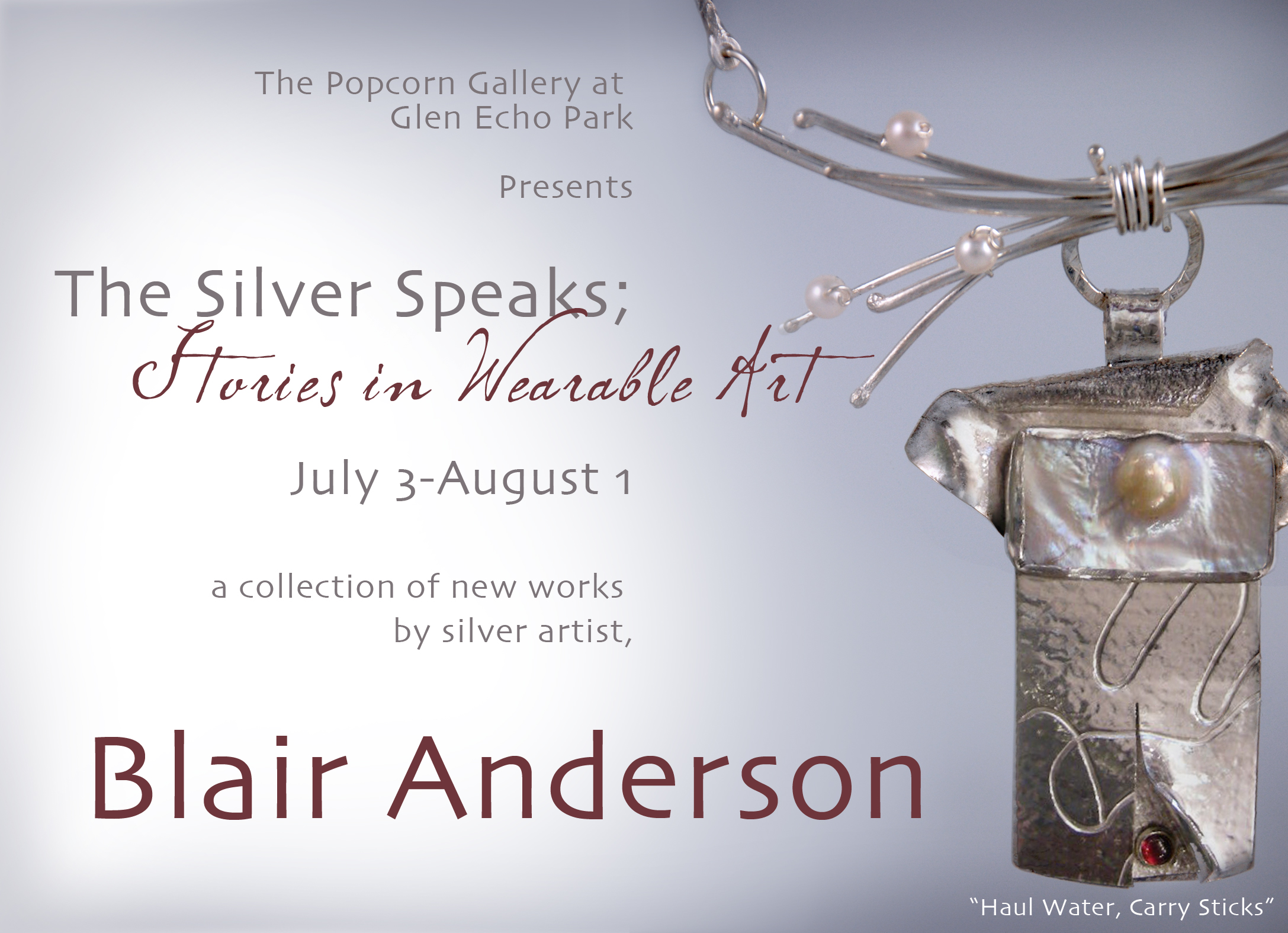 Silver pendant necklace art piece.