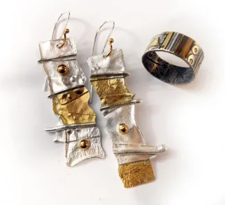 reticulated sterling silver earrings and textured bracelet both with gold plated accents