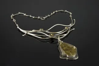 Silver pendent including Limu