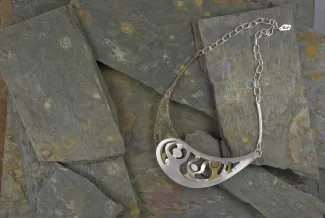 Finding One's Self necklace on slate