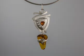 Silver pendant with yellow stones