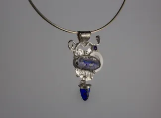 Silver pendant with blue stones