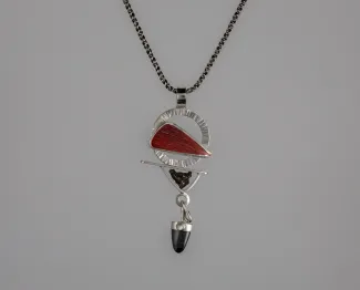 Silver pendant with black and red stones