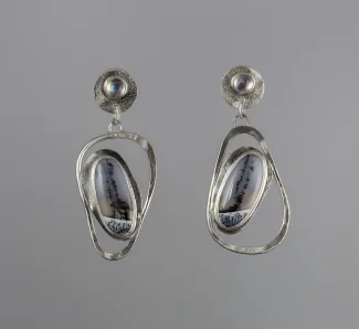 Silver earrings with a black and white stones