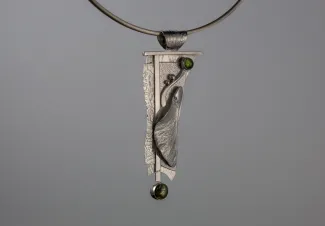 Silver pendant with green stones