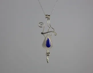 Silver pendant with dark blue stone