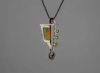 Silver pendant with several stones