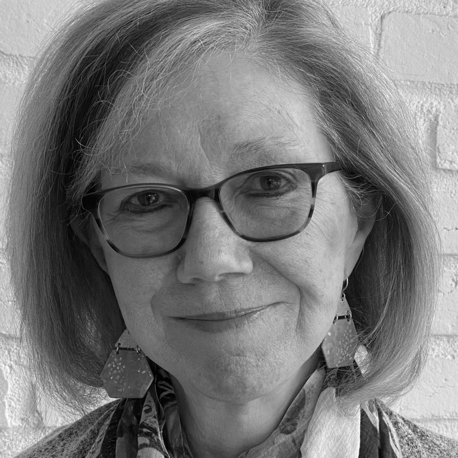 A smiling woman with glasses