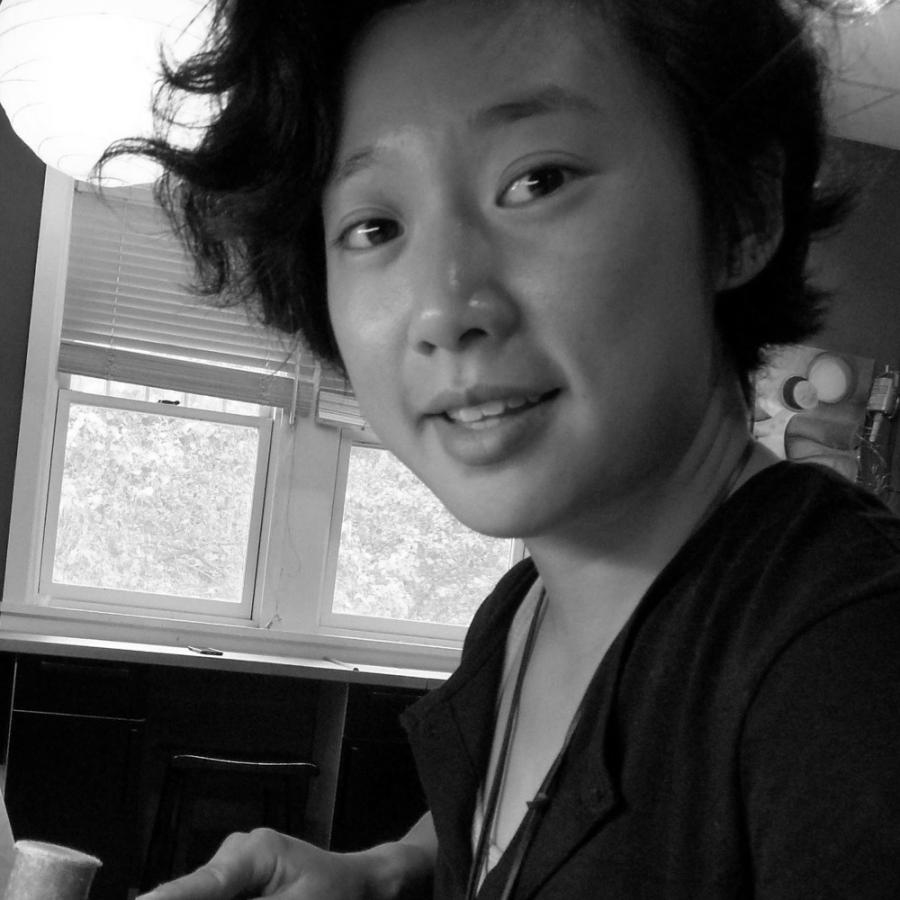 Young woman in a metalsmithing studio.