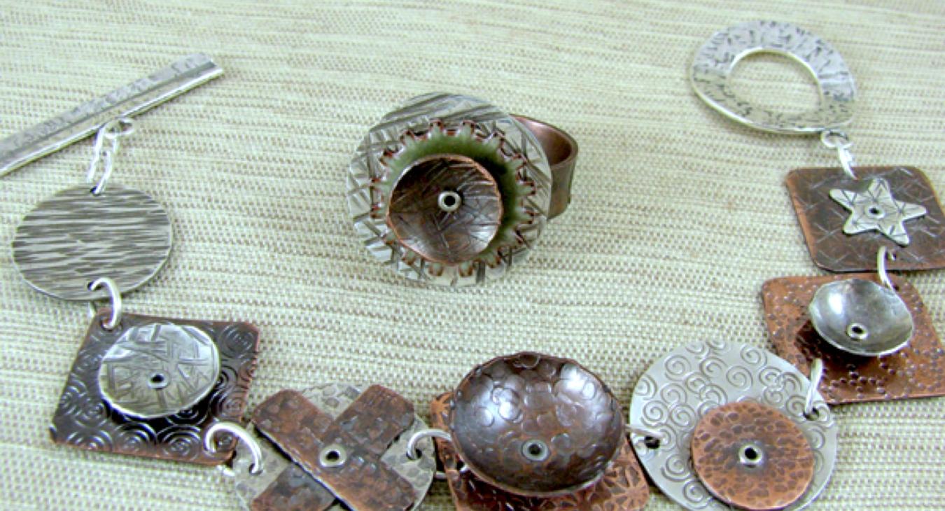 a copper and silver riveted bracelet