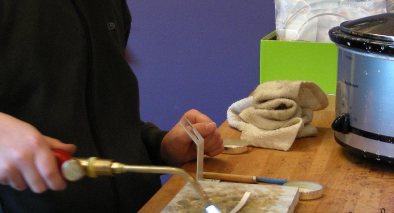 A young man using a torch