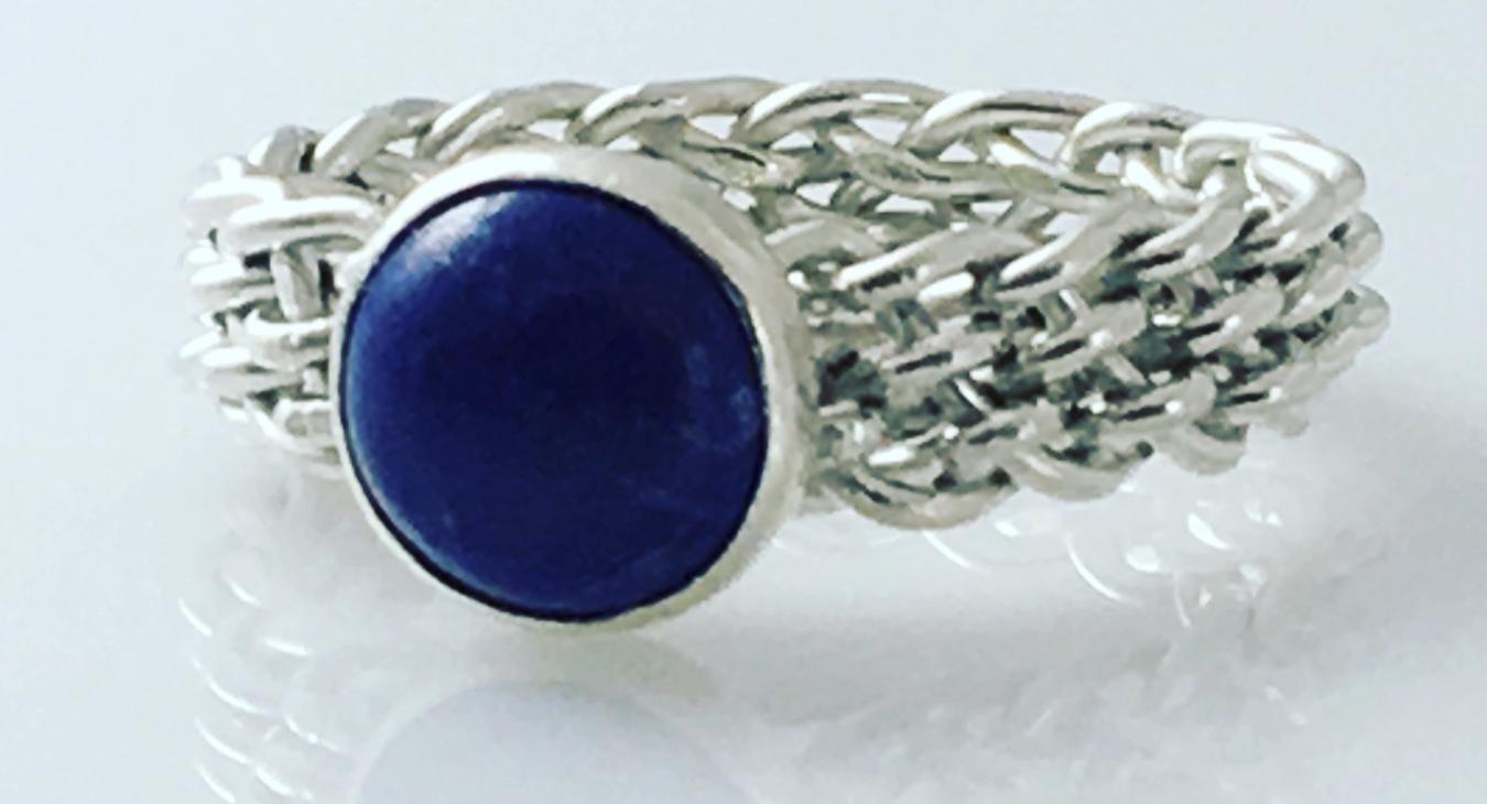 A wire woven ring with a blue stone
