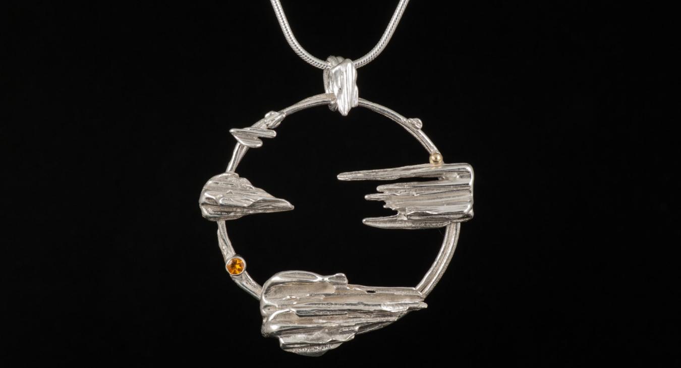 silver necklace with pointed silver cast pieces