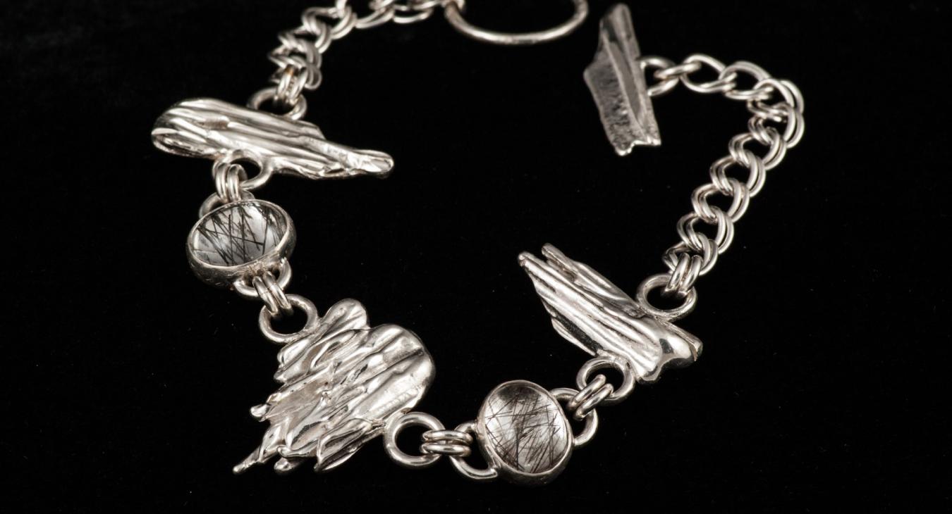 silver chain loop necklace with broom-cast silver pieces