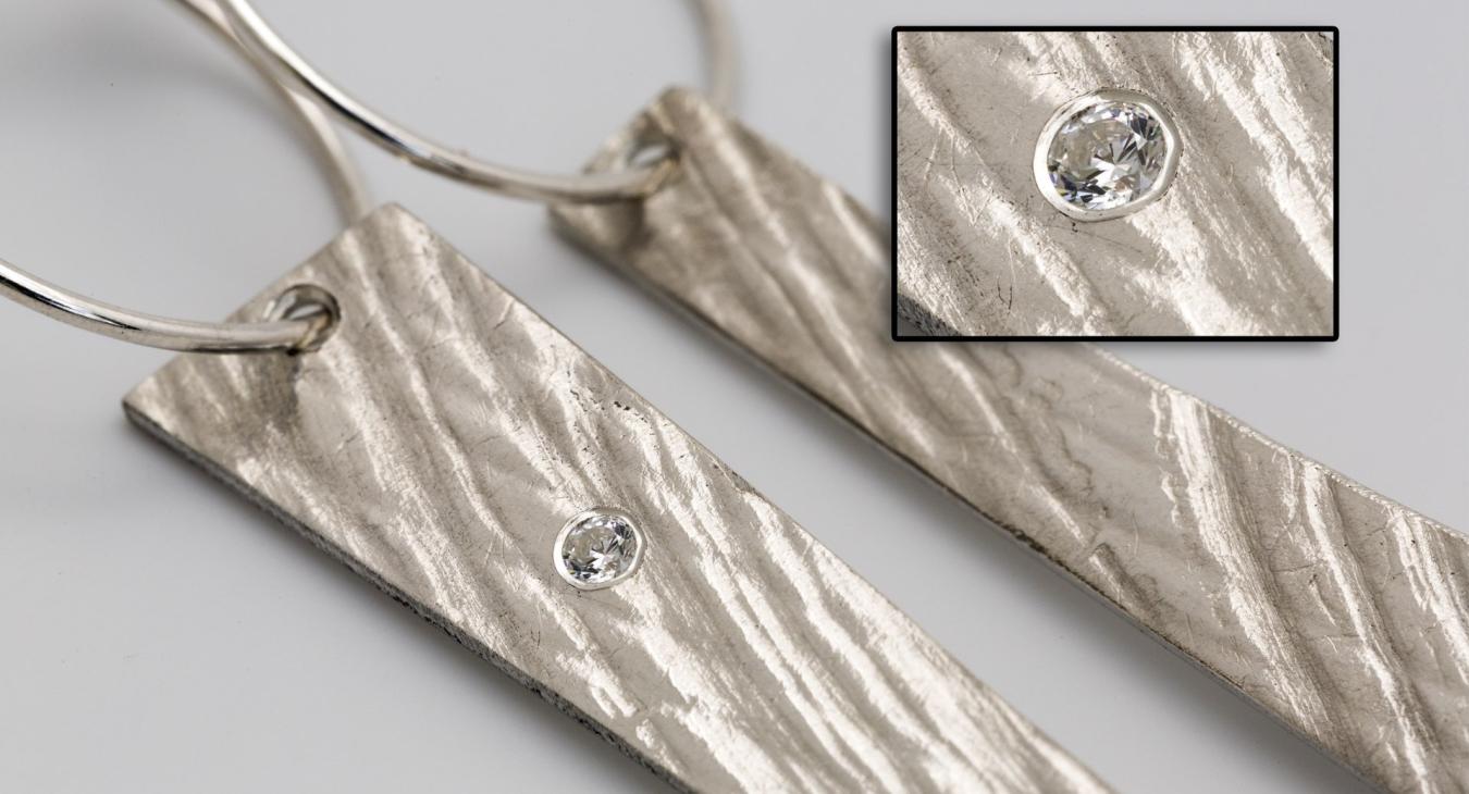 Clear faceted stone set in silver