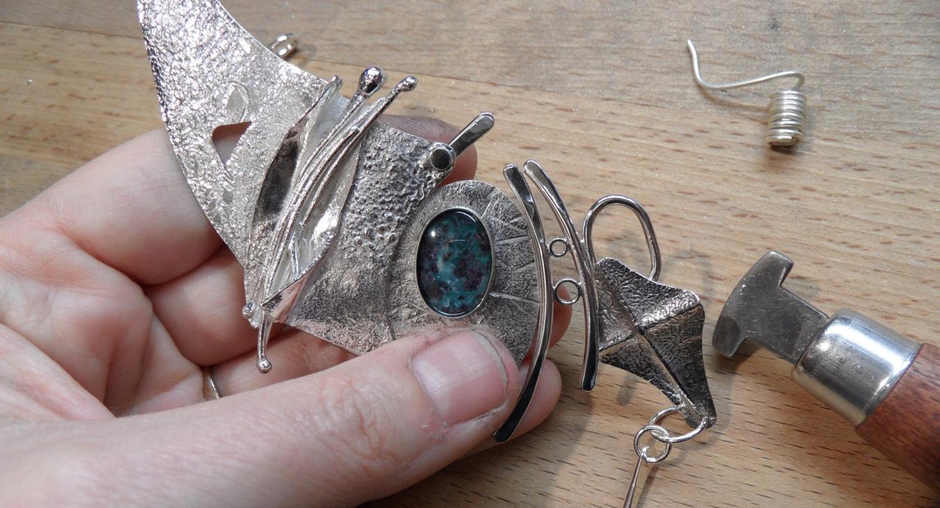 Holding the nearly finished piece