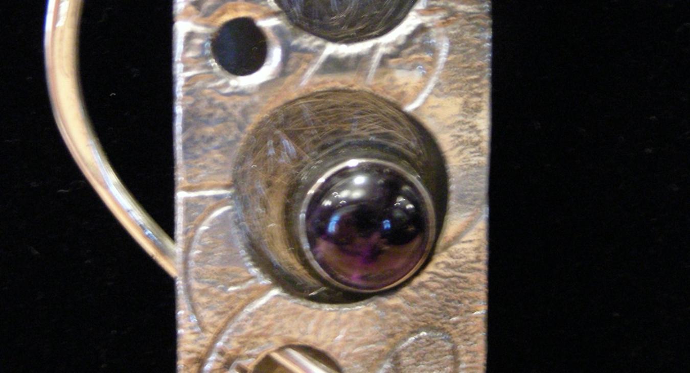 close up of amethyst on pendant