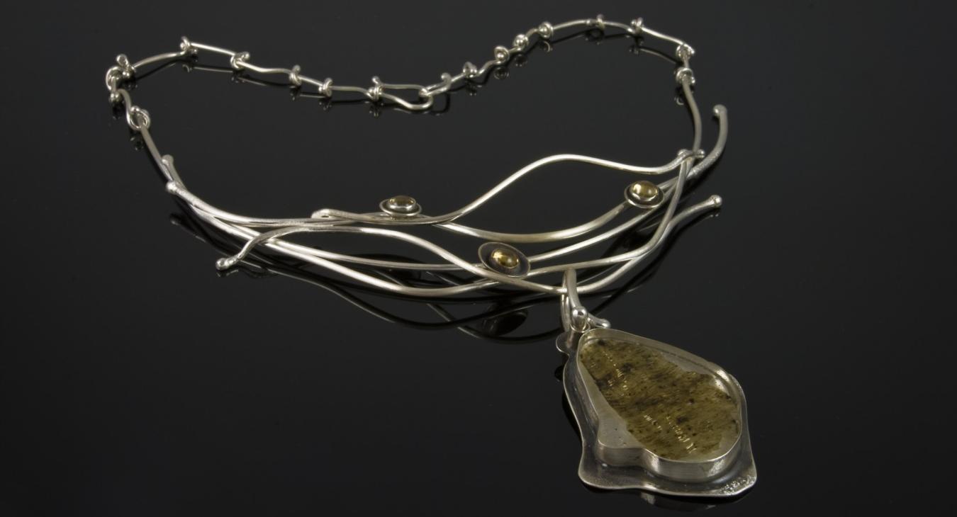 Silver wire necklace with rutilated quartz pendant