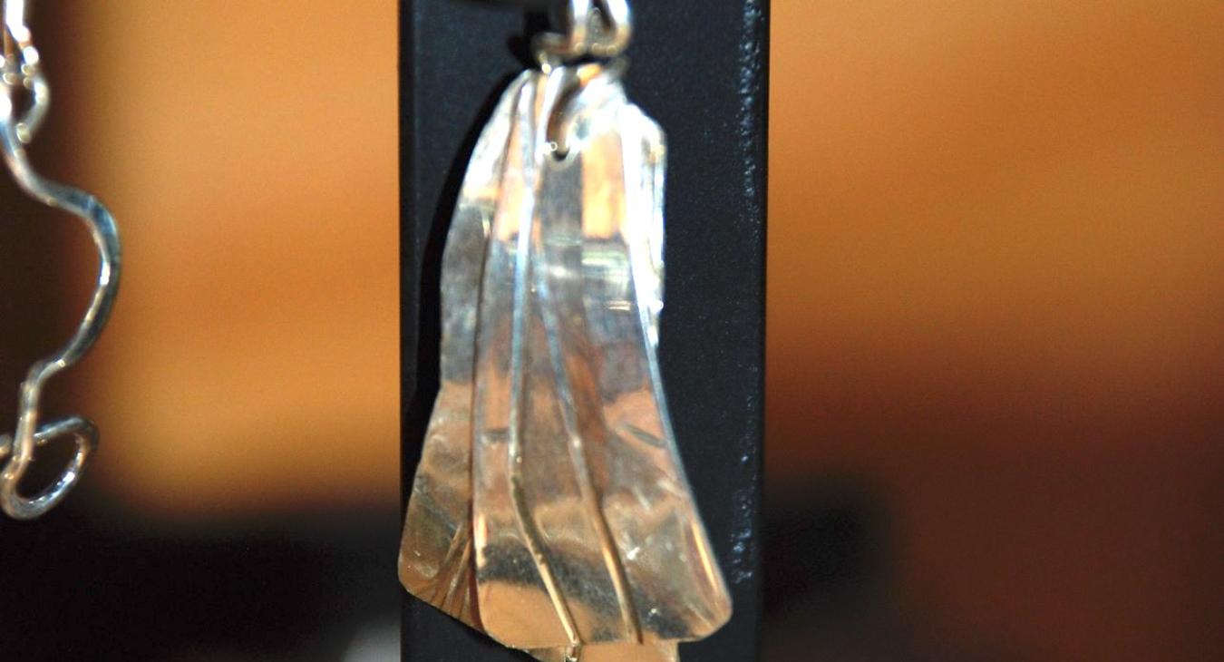 Two part flattened silver pendant by Sandy.