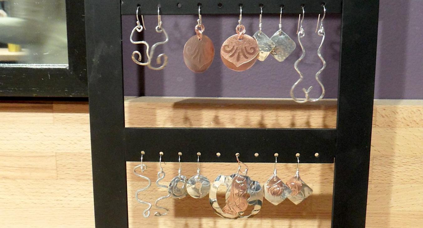 Student earrings on rack