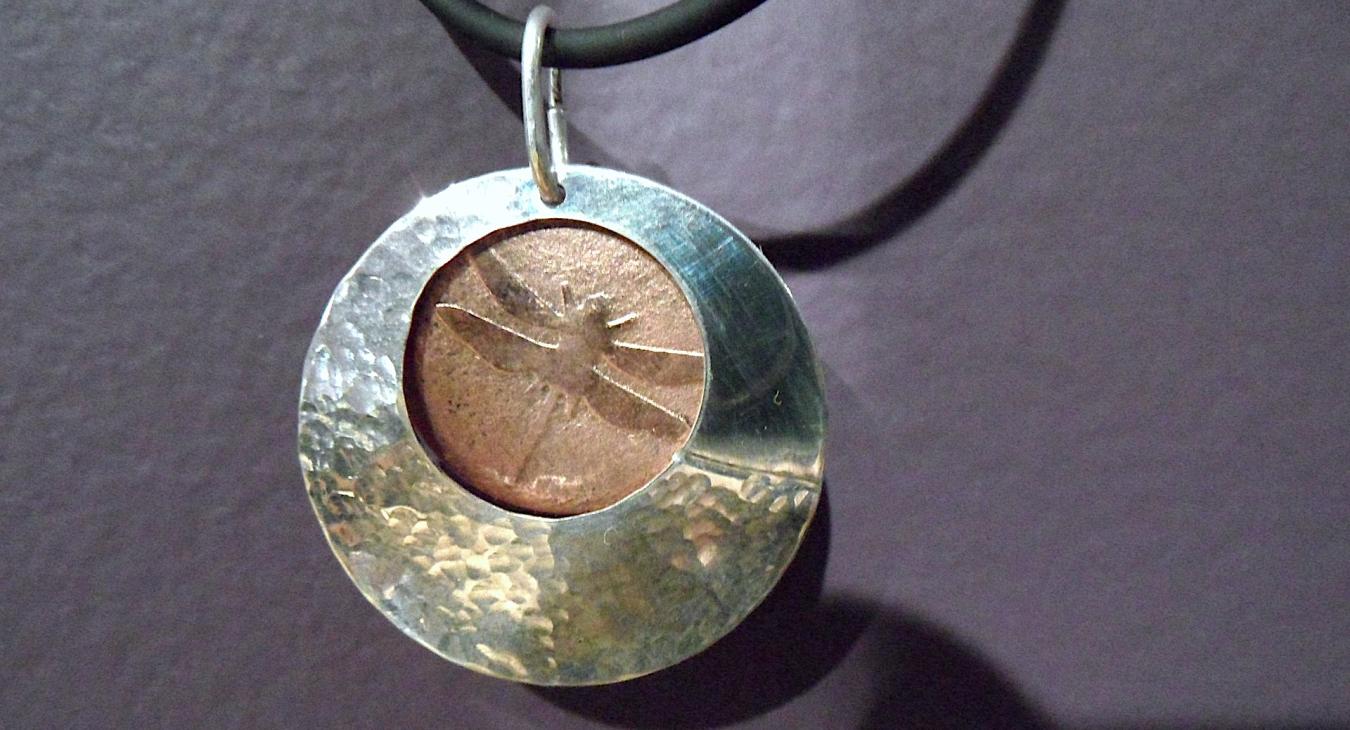 Silver and copper layered textured pendant with dragonfly 