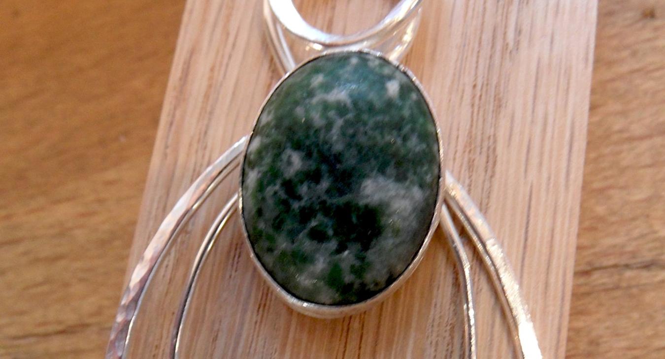 Hammered Loop Pendant with green speckled stone by Grace Kim.