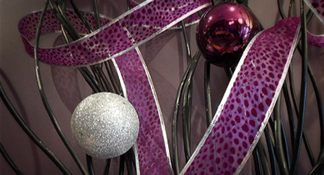Purple ribbon and christmas ornaments