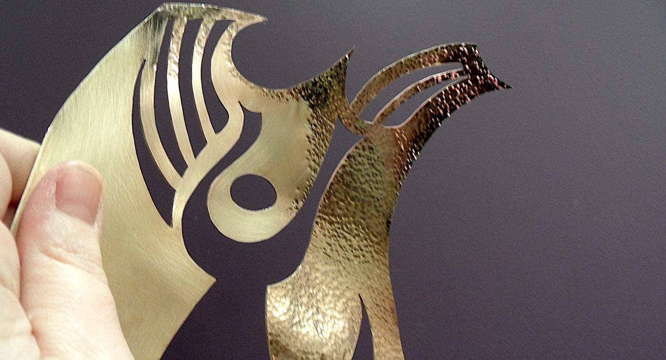 Brass piece with partial hammer texture