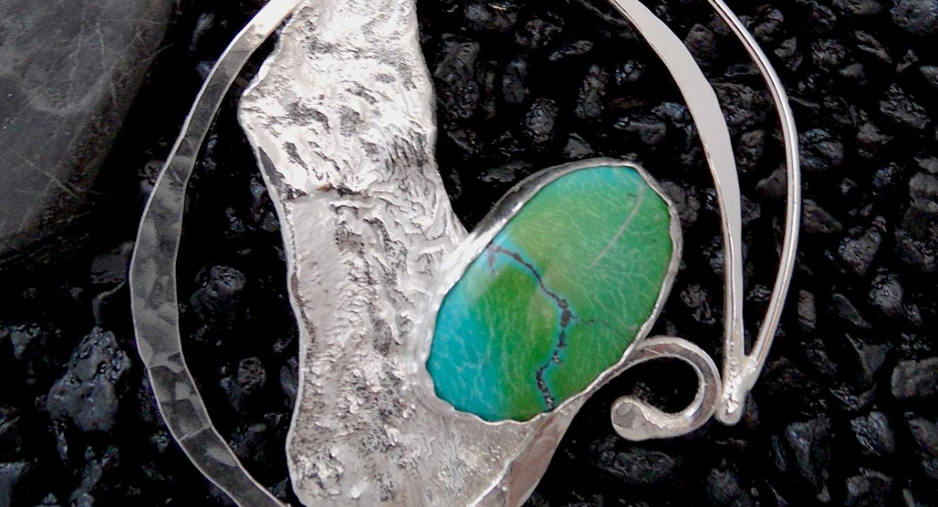 Textured silver wire and reticulation pendant with green stone