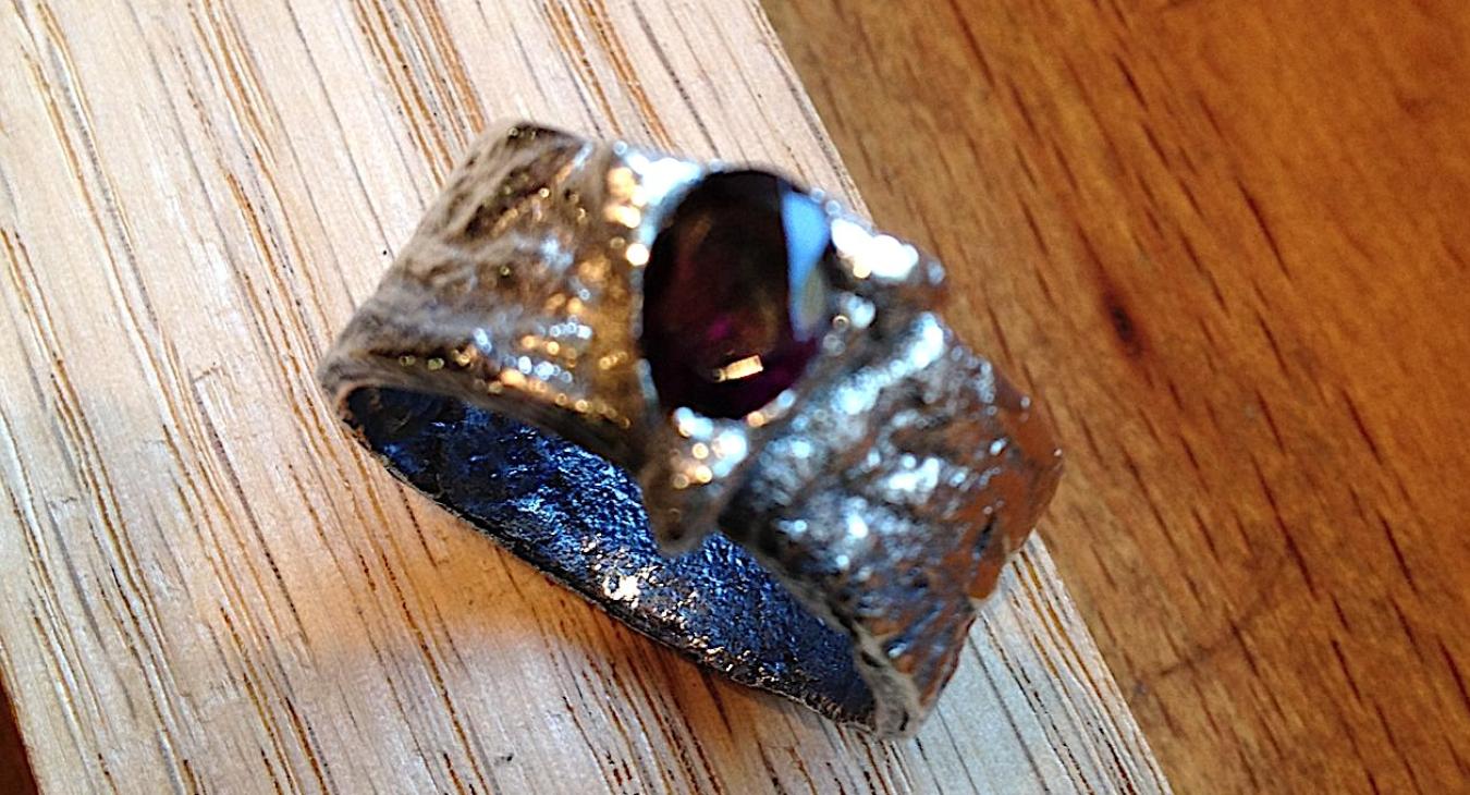 Student PMC ring with dark red gem