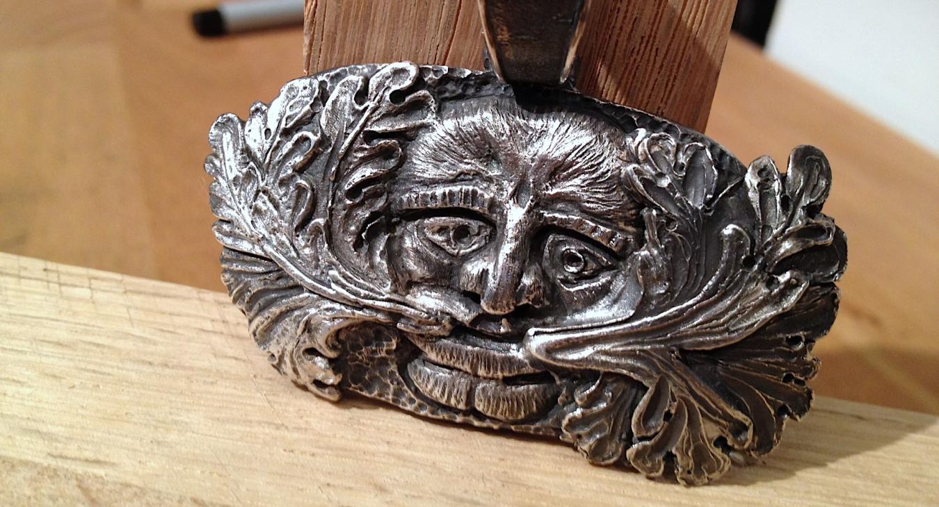 Finished cast face pendant