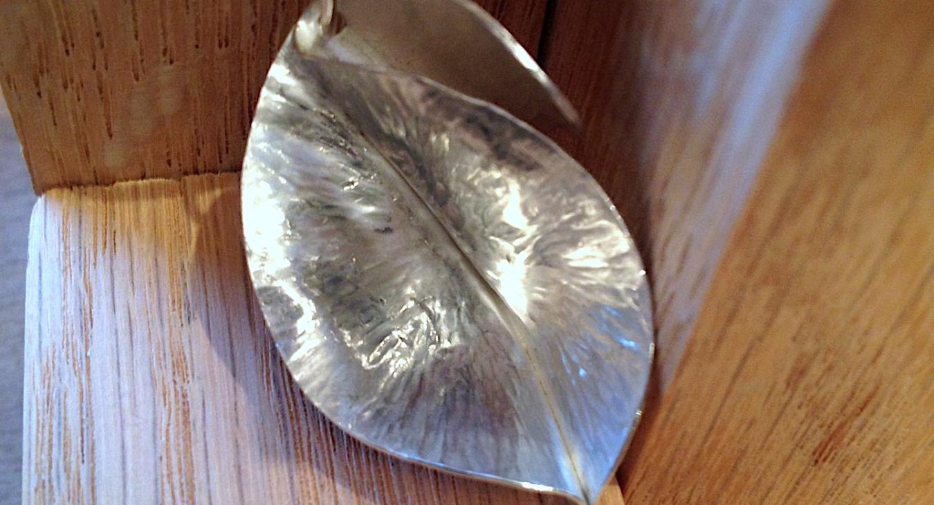 A silver Fold-Formed leaf pendant