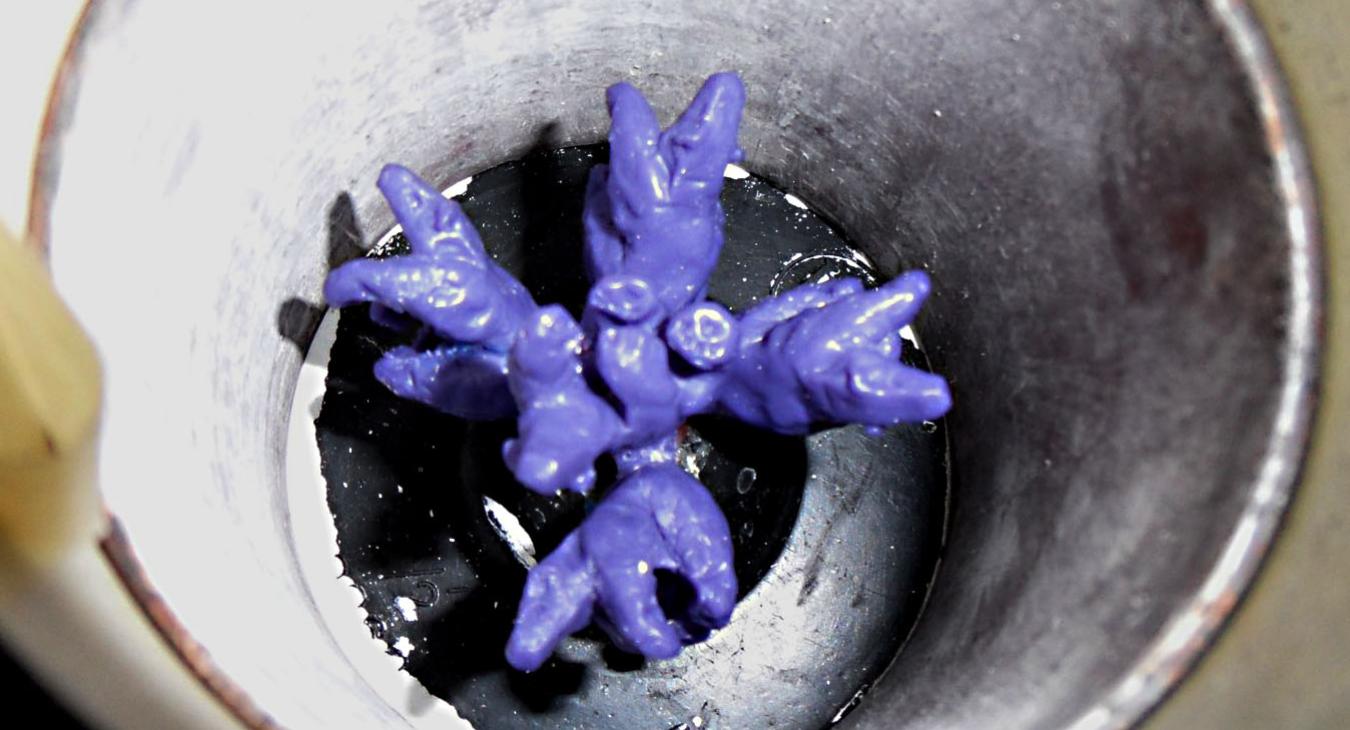 Wax tree of bears inside flask before burnout