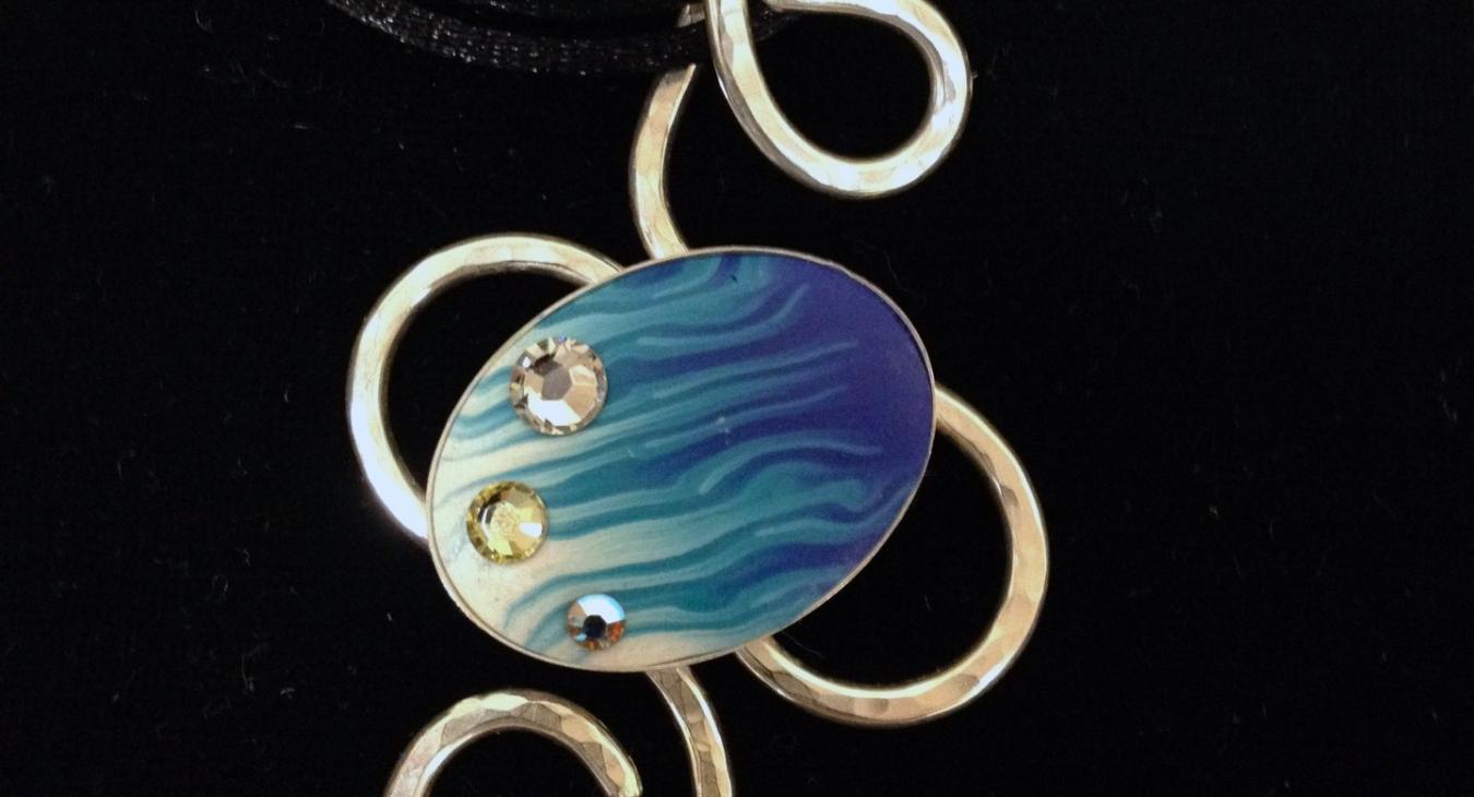 Blue patterned clay with gems set on twist silver pendant