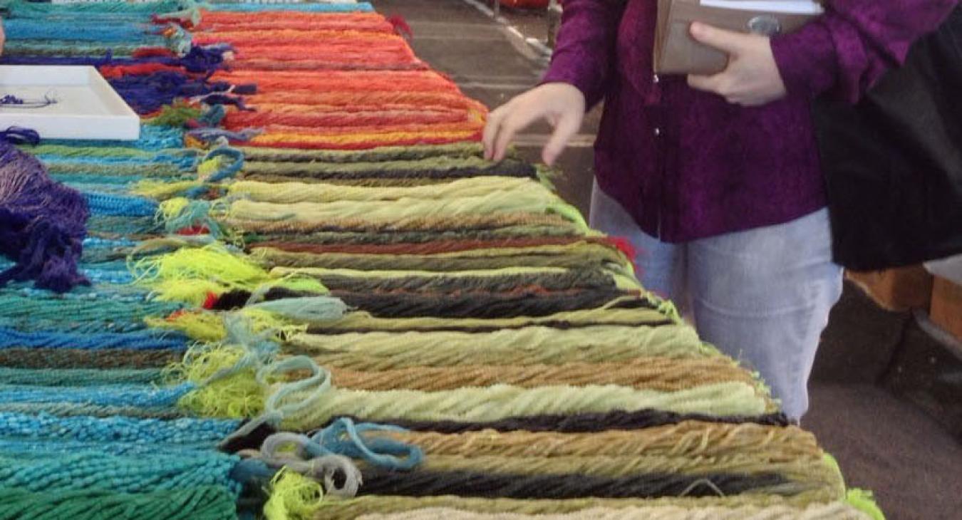 Blair looking at display of many beads