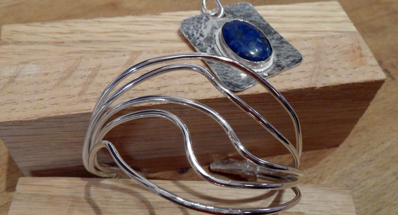Blue stone textured pendant and multi-wire twisted cuff 