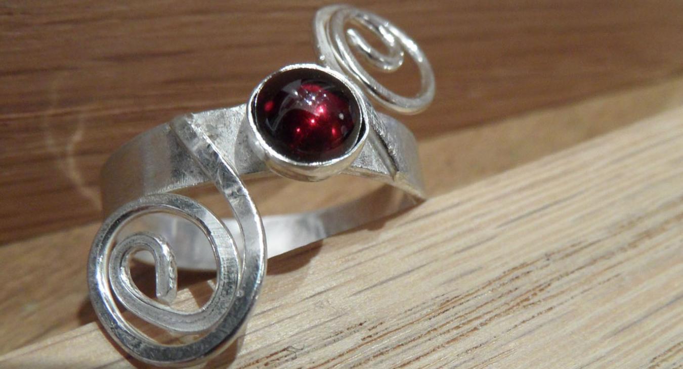 Silver garnet ring with spiraled wire 