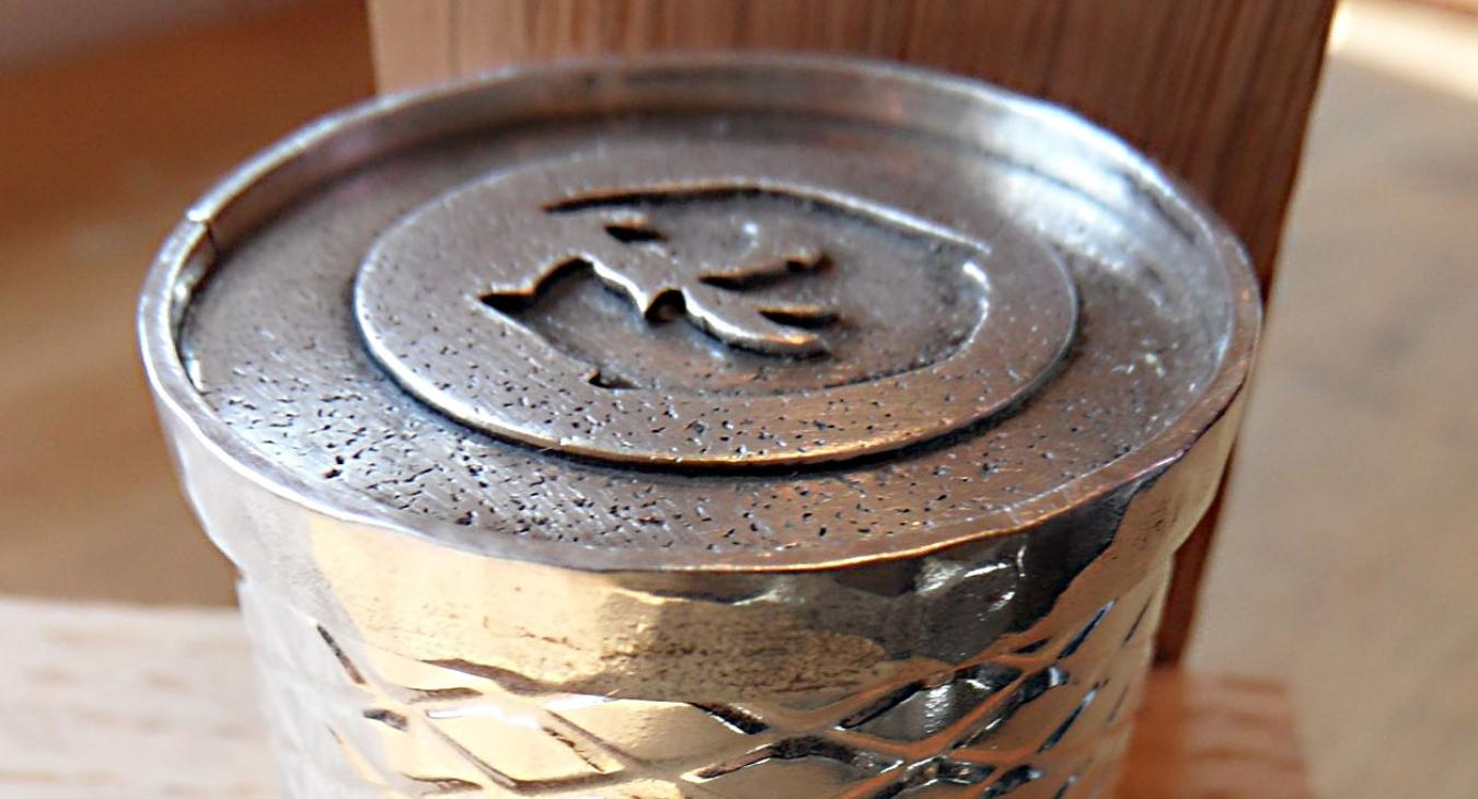 Student silver box with wire fence textured outside and shrimp imprint on top