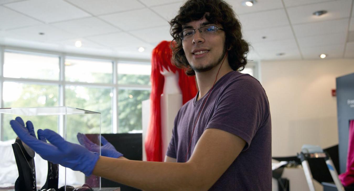 David polishing the show's acrylic cases