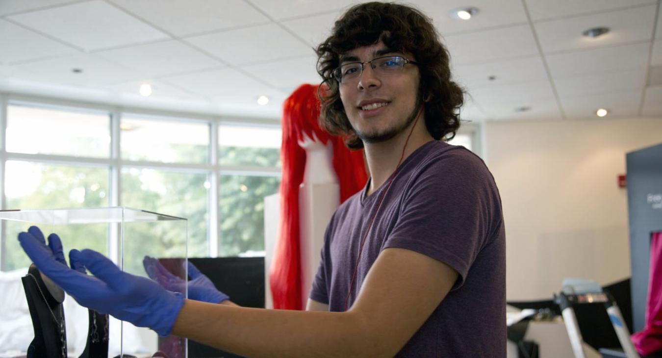 David polishing the show's acrylic cases