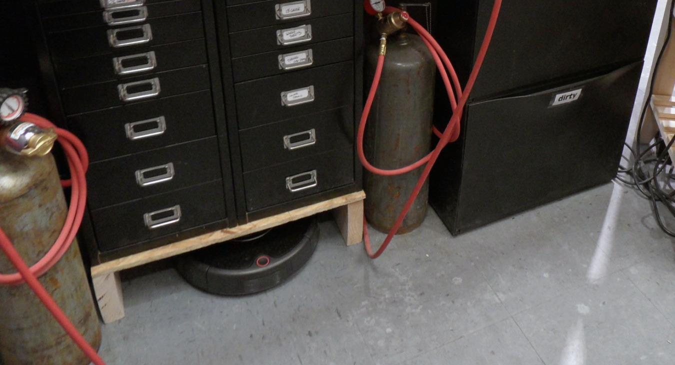 soldering station with drawers and roomba underneath