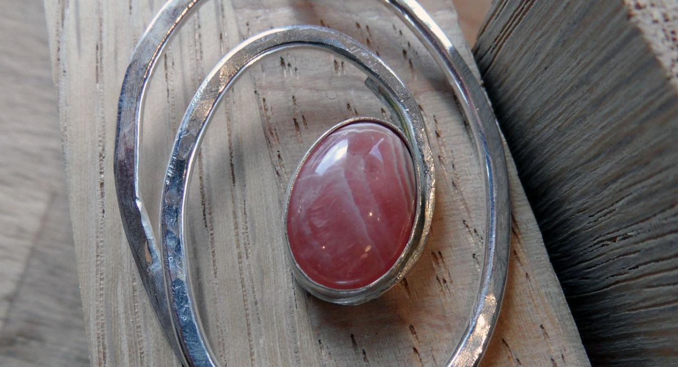 pink stone set on silver wire spiral pendant