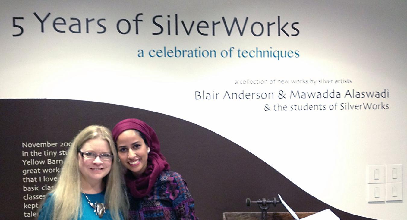 Blair and Mawadda by the title wall