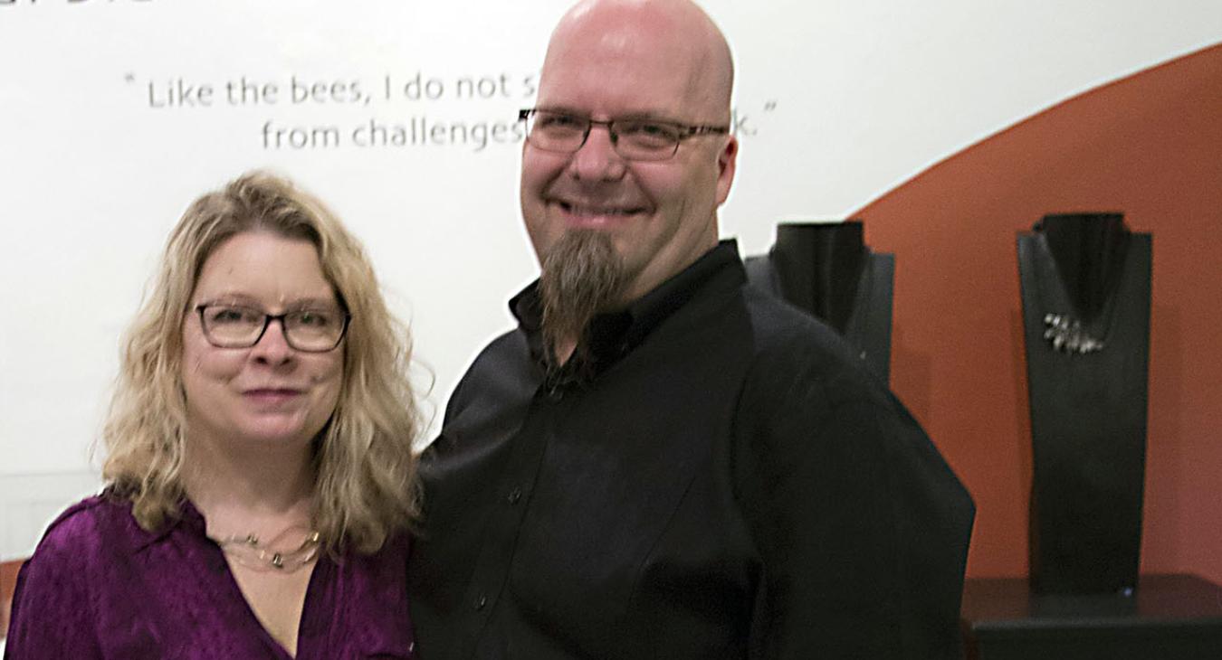Blair and Bryan posing for photo at the show opening