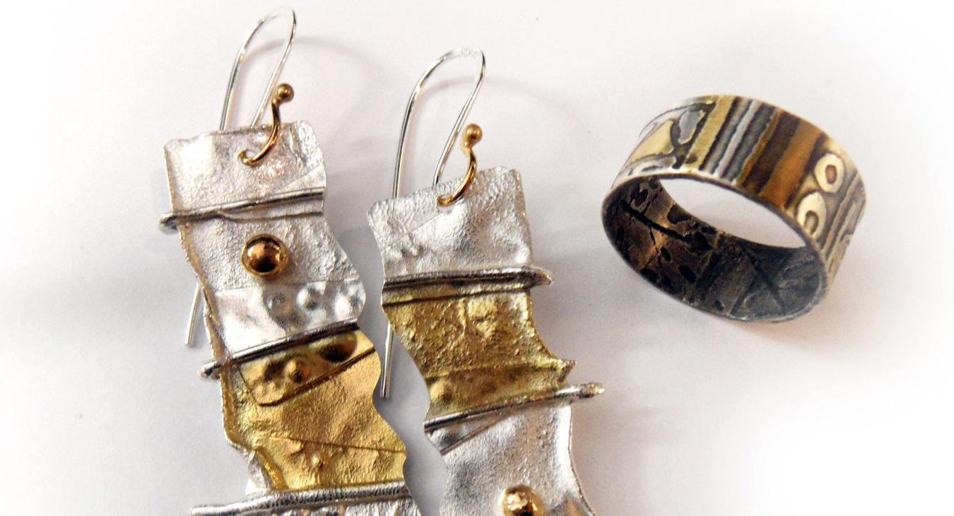 reticulated sterling silver earrings and textured bracelet both with gold plated accents