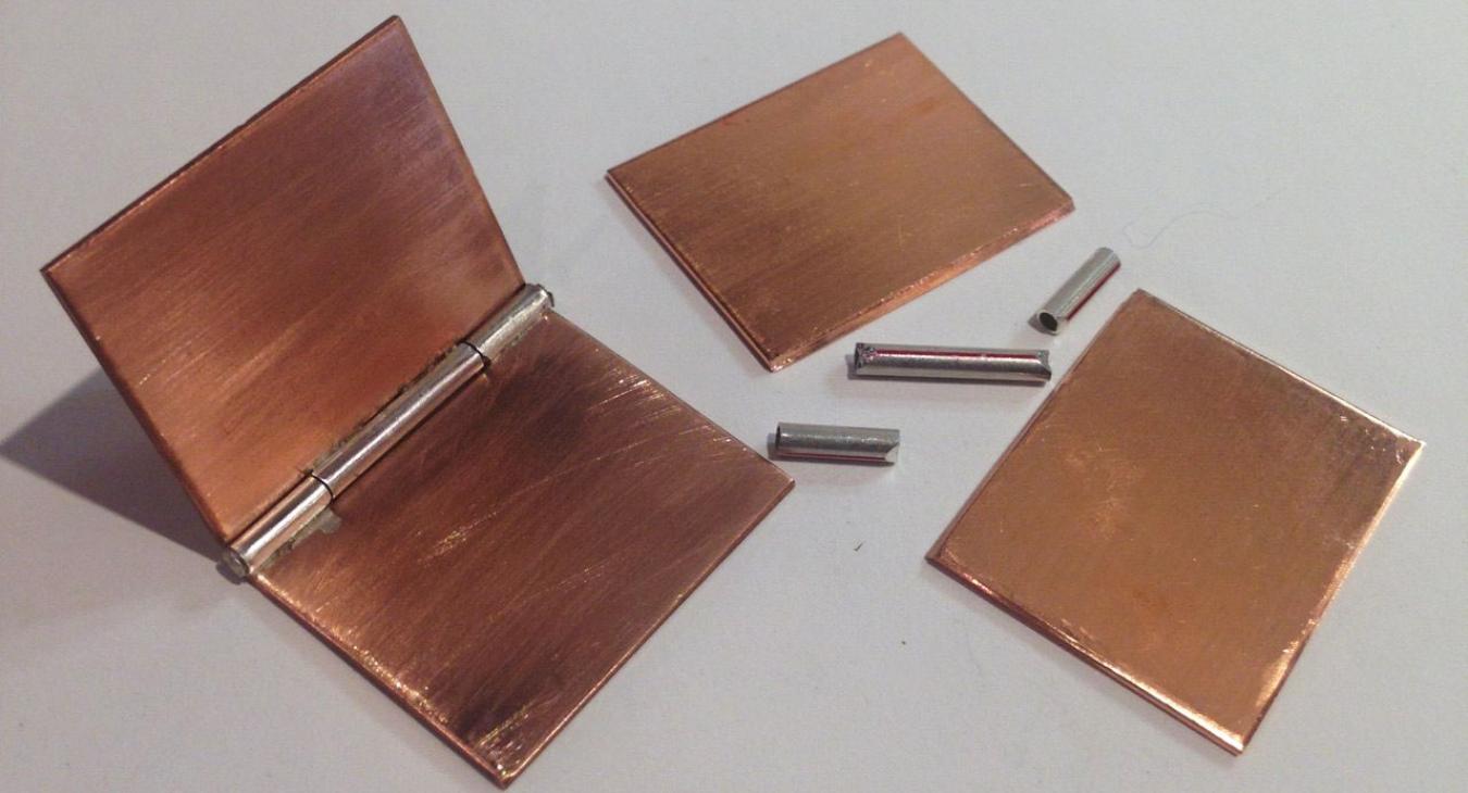 copper pieces with hinges, together and deconstructed