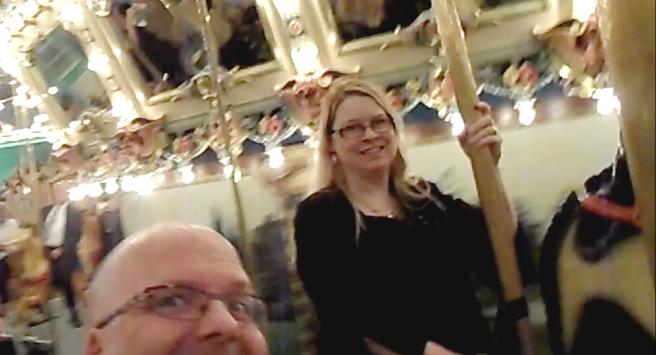 Bryan and Blair riding the carousel