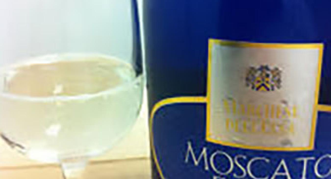 Blue moscato bottle with filled glass