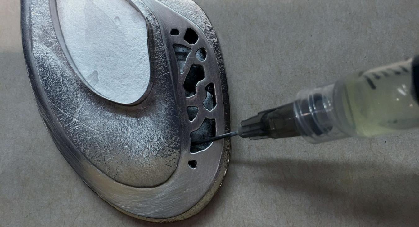 using syringe to injectthe cutout pendant with oxidizer