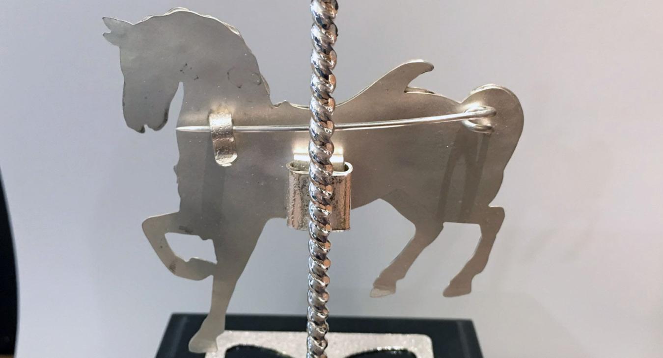 backside of award showing brooch pin 